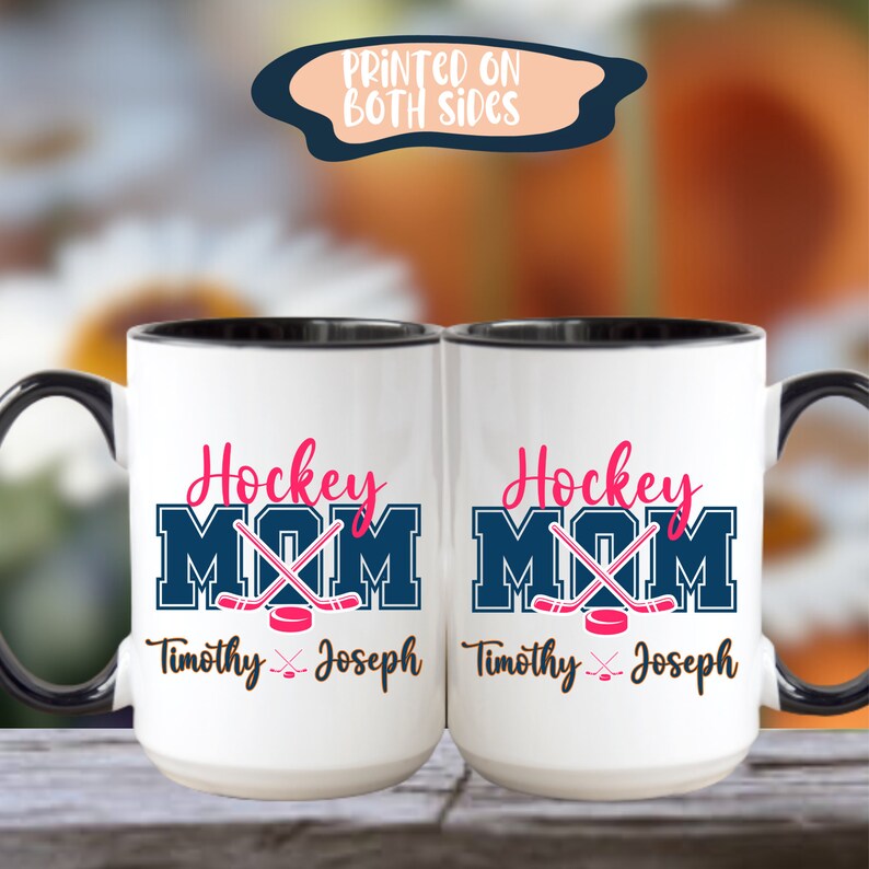 two coffee mugs sitting on top of a wooden table