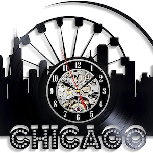 May include: Black vinyl record clock featuring a silhouette of the Chicago skyline with the Ferris wheel and the words "Chicago" in silver glitter letters.