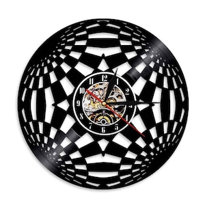 May include: Black and white wall clock with a unique geometric design. The clock face features a visible mechanical movement and black hands with a red second hand. The clock is made from a repurposed vinyl record.