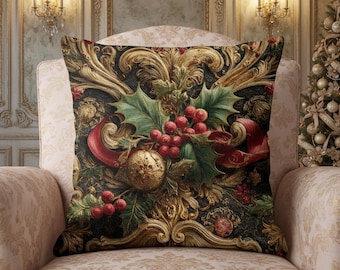 May include: A square throw pillow featuring a dark background with an ornate gold scrollwork pattern, green holly leaves, bright red berries, and a red ribbon. The design includes a textured gold sphere ornament centered among the foliage.