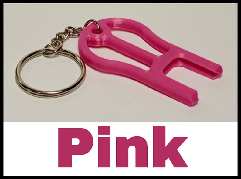 May include: A pink plastic keychain tool with a key ring. The tool has a unique shape and is designed to help open things.