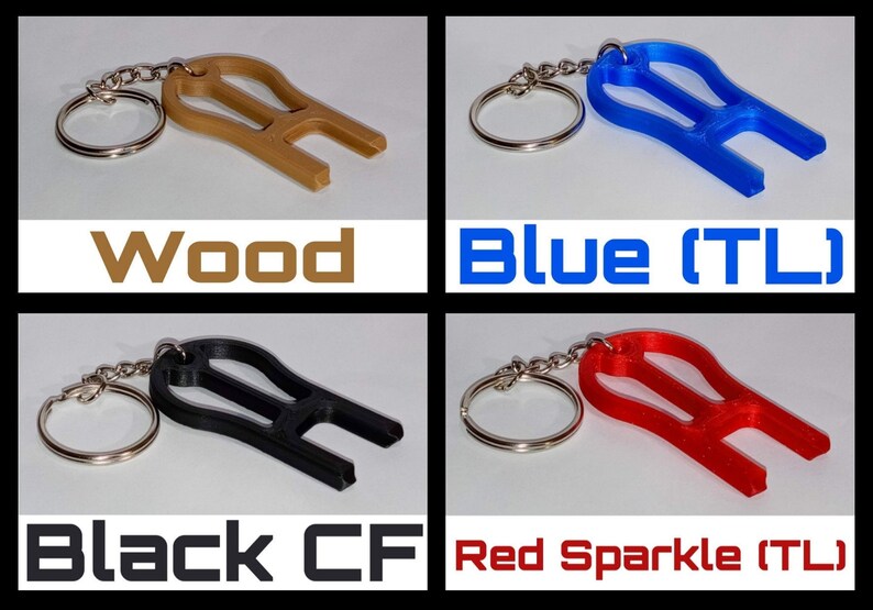May include: Four keychains with different colored plastic charms. The charms are shaped like a guitar pick with a hole at the top. The keychains are labeled "Wood", "Blue (TL)", "Black CF", and "Red Sparkle (TL)".