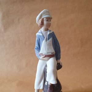Perfect Lladró  #4810 &quot;Boy With Yacht &quot; In superb condition with original box. Stands 9&quot; inches high.  Perfect condition Lladro 4810    #162