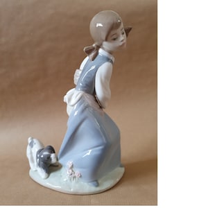 Cheeky Lladró  #4982  &quot;Naughty Dog&quot;  Dog pulling on girls dress. Figure stands 7.75&quot; inches tall  Excellent condition   Lladro 4982  #135