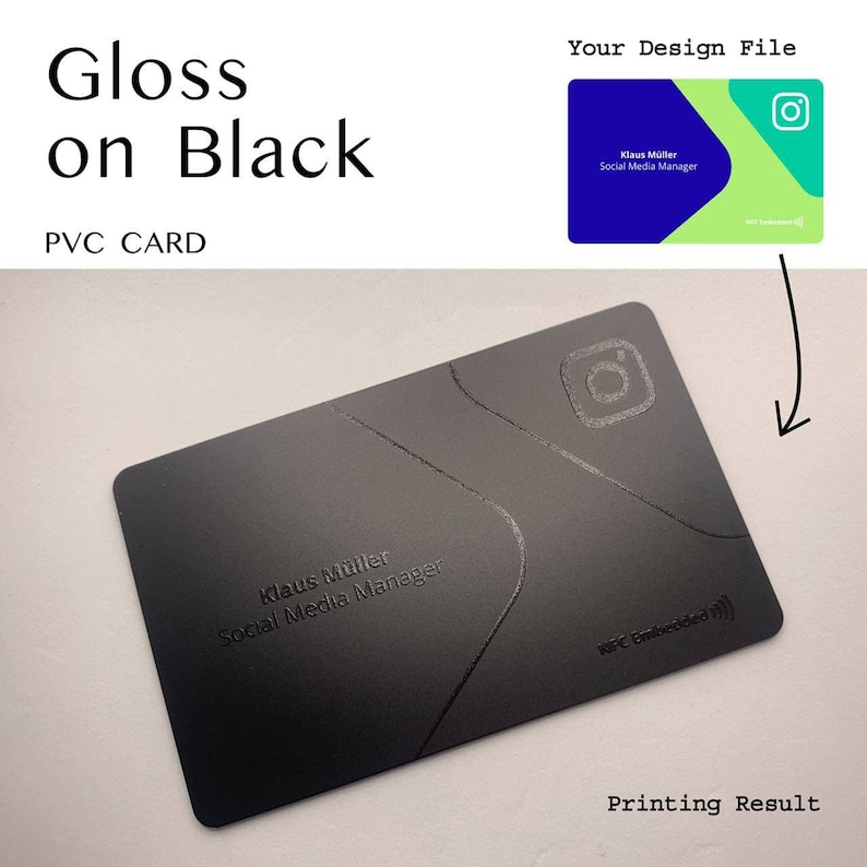 May include: A black PVC business card with a glossy finish. The card features a white embossed design with the text "Klaus M&uuml;ller Social Media Manager" and an Instagram logo. The text "NFC Embedded" is also visible on the card.