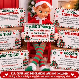 May include: Six rectangular holiday signs with red and green festive borders, snowflakes, and gift graphics. Each sign features unique printed text including phrases like You Were Awesome Today, I Saw That, Make It Yours, and Welcome Back.