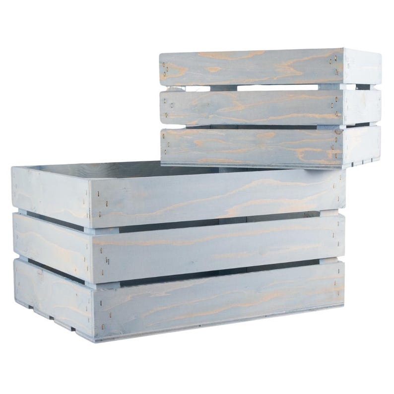 May include: Two light blue wooden crates with a rustic finish. The larger crate has three horizontal slats and the smaller crate has two horizontal slats.