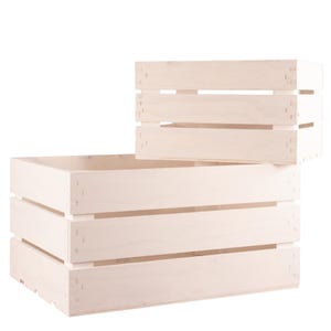 May include: Two white wooden crates, one stacked on top of the other. The larger crate has three horizontal slats, while the smaller crate has two slats.