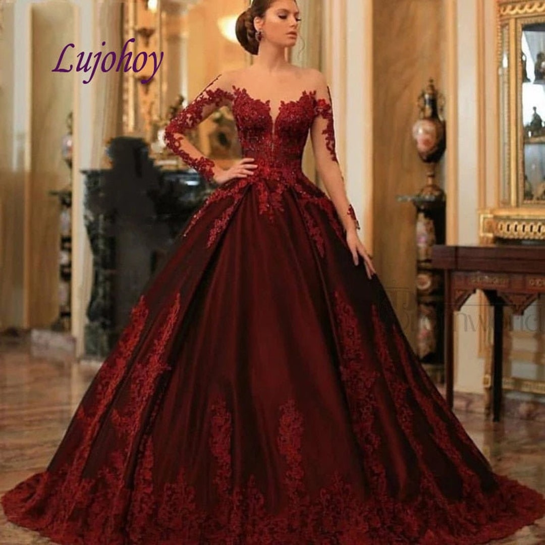 Shop sheer neckline red & black applique ball gown quinceanera dress with  long sleeves from