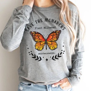 K&ouml;nnte beinhalten: Graues Langarmshirt mit einem Motiv eines Monarchfalters und dem Text "Save the Monarchs Plant Milkweed #GotMilkweed".