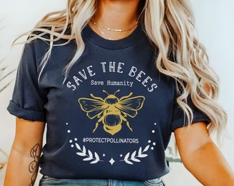 May include: A navy blue t-shirt with a white graphic of a bee and the text "Save the Bees Save Humanity #ProtectPollinators".