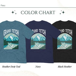 May include: Three short-sleeved t-shirts in teal, navy, and black heather. Each shirt features a graphic of mountains and water with the text "GRAND TETON". The color chart below the shirts indicates the color names.
