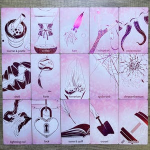 May include: A set of 16 pink cards with illustrations of various objects, including a mortar and pestle, coffee maker, lure, slingshot, pepperoncini, shell, furin, terrarium, spiderweb, chrysanthemum, lightning rod, lock, tome and quill, trowel, and dumbbell.
