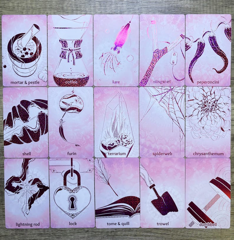 May include: A set of 16 pink cards with illustrations of various objects, including a mortar and pestle, coffee maker, lure, slingshot, pepperoncini, shell, furin, terrarium, spiderweb, chrysanthemum, lightning rod, lock, tome and quill, trowel, and dumbbell.