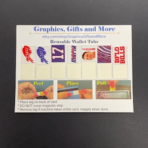 May include: Reusable wallet tabs with a blue and red Buffalo Bills logo, a player's photo, and the number 17. The tabs are designed to be placed on the back of a credit card to help with pulling it out of a wallet.