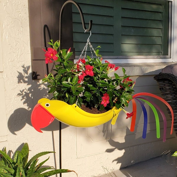 Sunny the Parrot.  Bright, colorful, and classy. Add a plant that hangs/grows out, it will look like wings on the planter. :) Definite Fav.