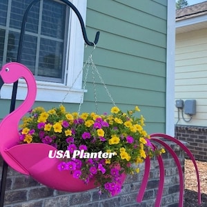 "Flo" the Flamingo Planter.  Only manufactured by USA Planter.  Made/ patented in USA. Dimensions --   24'x9'x7',  large planter, holds up to a gallon of soil, recyclable plastic with UV protection.