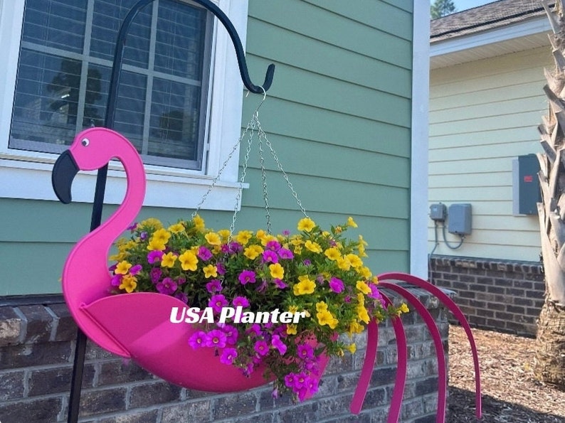 "Flo" the Flamingo Planter.  Only manufactured by USA Planter.  Made/ patented in USA. Dimensions --   24'x9'x7',  large planter, holds up to a gallon of soil, recyclable plastic with UV protection.