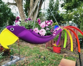 Patty the Purple Parrot . A really fun parrot. Definitely a conversation piece. A very deep purple body and yellow beak are happy and fun.