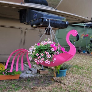 Fancy "Flo" the Flamingo.  Definitely a must have. Bright pink in color and manufactured by  USA Planter.