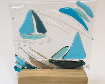 Beautiful fused glass sailboats in light oak wooden stand