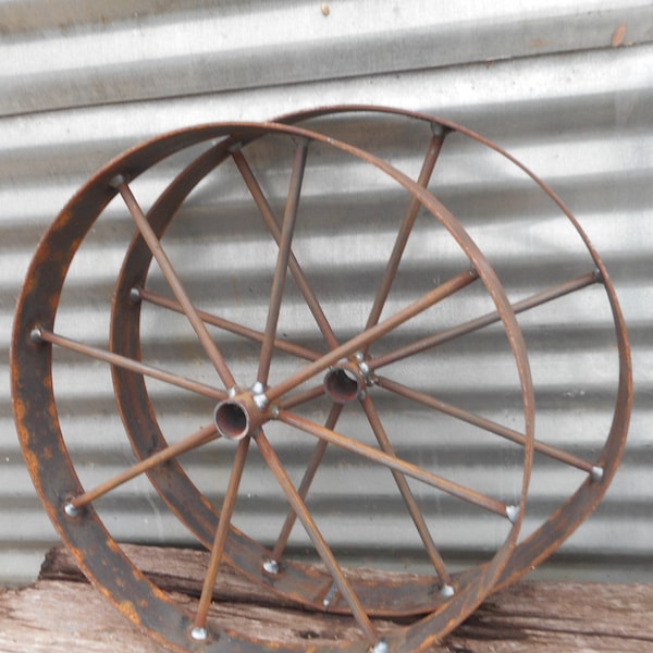 A pair of 24" wagon wheels , rustic art Bar b q pits wagons etc, Barbeque