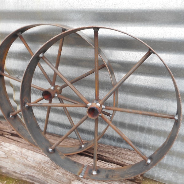 A pair of 16" wagon wheels , rustic art Bar b q pits wagons etc, Barbeque