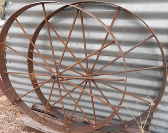 A pair of 30" wagon wheels , rustic art decor Bar b q pits wagons etc, Barbeque