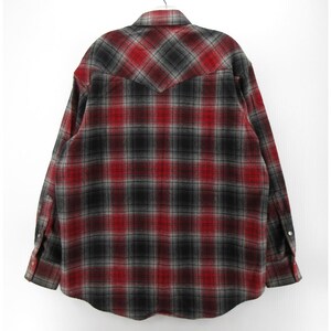 May include: A long-sleeve button-down shirt featuring a red, black, and grey plaid pattern. The shirt has a pointed collar, a western-style back yoke, and cuffs with button closures. The fabric displays a soft, brushed texture throughout the garment.