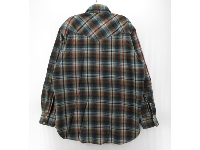 May include: A long-sleeve button-down shirt featuring a plaid pattern in shades of dark green, brown, and grey with thin red vertical and horizontal stripes. The shirt has a pointed back yoke, a standard collar, and buttoned cuffs on the sleeves.