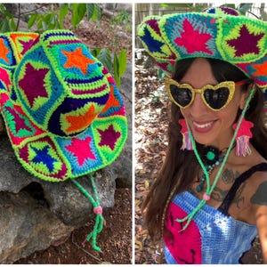 May include: A vibrant, handmade crochet cowboy hat in neon green, pink, orange, blue, and purple. The hat features star-shaped designs and a green chin strap with a pink bead. The hat is a unique, eye-catching accessory.