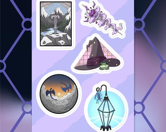 May include: A sheet of fantasy-themed stickers featuring a sword in a snowy landscape, a purple staff, a witch's hat with a frog, a circular image of dragons, and a decorative lantern.