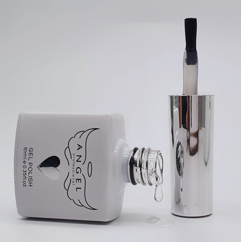 May include: A white bottle of Angel Professional Gel Polish with a silver cap and a black brush. The bottle is labeled "GEL POLISH 10ml e 0.35fl oz".