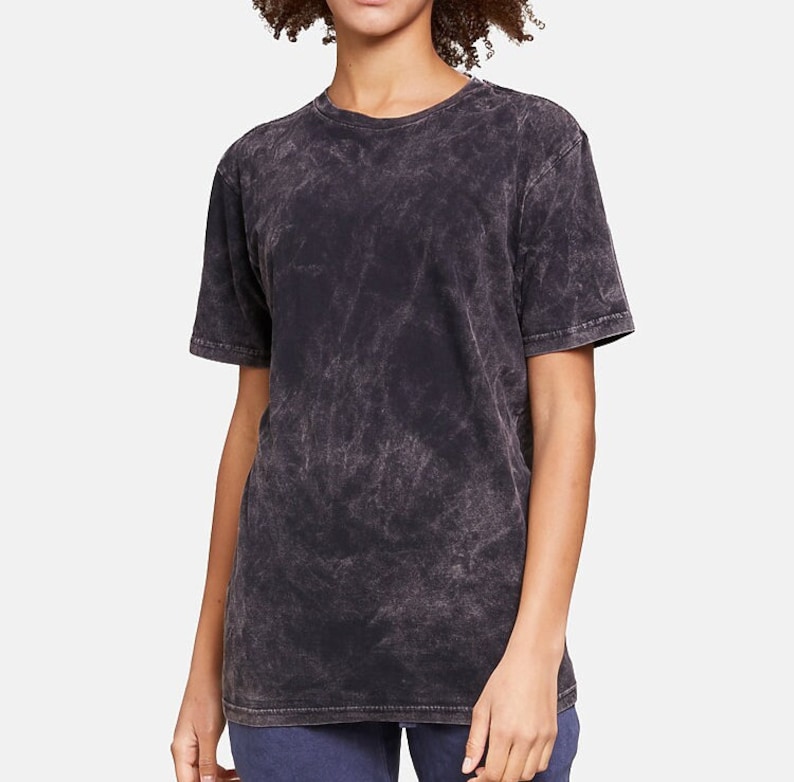 May include: A black acid wash t-shirt with a crew neck and short sleeves.