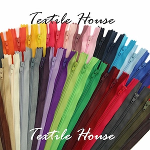May include: A selection of colourful zips in a range of hues, such as orange, yellow, pink, purple, green, and blue. The zips are arranged in a fan shape, with the text "Textile House" in a script font. These are suitable for sewing and craft projects.