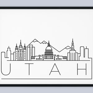 Può includere: Illustrazione in bianco e nero a linee dell'orizzonte di Salt Lake City, che include il Tempio di Salt Lake City, l'edificio del Campidoglio dello Utah e le montagne Wasatch. Il testo "UTAH" è sotto l'orizzonte.