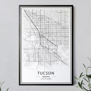May include: Black and white map print of Tucson, Arizona with the city name and coordinates at the bottom.