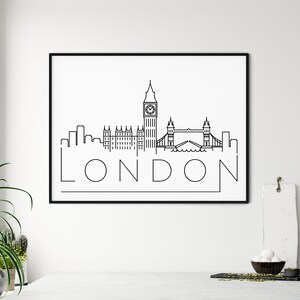 May include: Black and white line art print of the London skyline featuring Big Ben, the Houses of Parliament, and Tower Bridge. The word "LONDON" is written below the skyline.