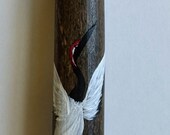 Dancing Japanese crane on bamboo stick