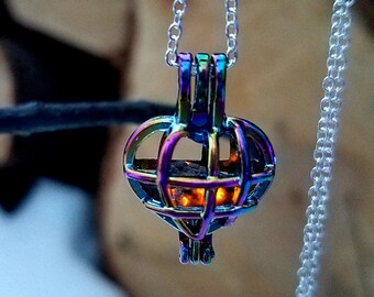 Iridescent Heart Cage Locket with Tiny Yooperstone Inside.  Fluorescent Sodalite.  FREE 365nm UV Viewing Light!!