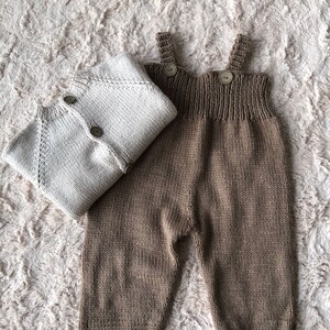 Set of brown overalls and ivory cardigan for babies under age 1.