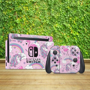 May include: Pink and white Nintendo Switch console and controller skin with a unicorn and flamingo design. The skin features rainbows, stars, and the text "Unicorn".