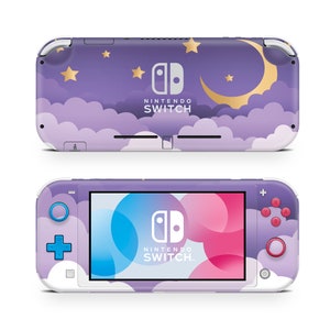 May include: Purple Nintendo Switch Lite console with a moon and stars design. The console has a white border and a pink and blue screen.