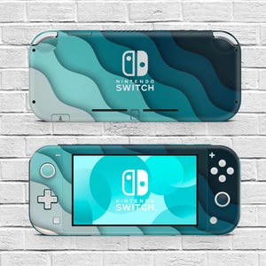 May include: A teal and blue Nintendo Switch Lite console with a wave pattern design. The screen displays a teal and white graphic. The Nintendo Switch logo is visible on the console.
