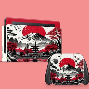 Pode incluir: Um console Nintendo Switch branco e um controlador com um design inspirado no Japão em preto e vermelho. O design apresenta uma montanha, um sol vermelho, uma pagoda e flores de cerejeira.