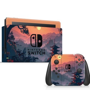 May include: A Nintendo Switch console and controllers with a scenic sunset design. The design features a Japanese pagoda, mountains, and trees in shades of orange, purple, and blue. The text "NINTENDO SWITCH" is visible.