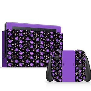 May include: Purple and black Nintendo Switch console and controller skins with a repeating pattern of a cartoon ghost wearing a witch hat.
