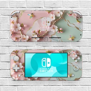 May include: Two Nintendo Switch consoles. The top console is a pink and green design with cherry blossoms and butterflies. The bottom console has a screen displaying a teal and blue design, with the Nintendo Switch logo.