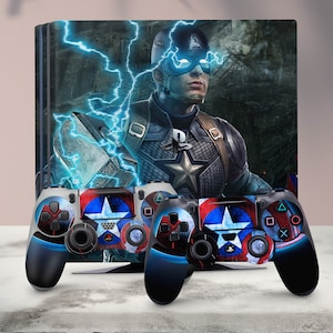 May include: A blue and red video game console with a Captain America design. The console is next to two matching controllers with the same design. The console and controllers feature a blue and red star design with a white background.
