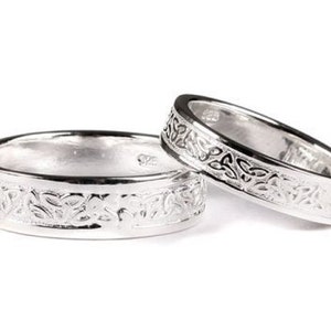 Celtic Design Sterling Silver His and Hers Wedding Ring Set.